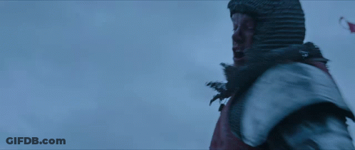 A Man In A Knight 'S Armor Is Screaming With His Mouth Open GIF