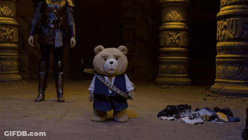 A Man In A Knight 'S Armor Is Standing In Front Of A Large Explosion GIF