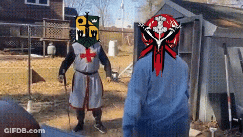 A Man In A Knight 'S Armor With A Cross On His Head GIF