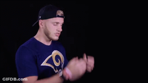 A Man In A La Rams Shirt Says It 'S A Catch In White Letters GIF