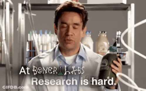 A Man In A Lab Coat Is Holding A Bottle Of Green Juice In Front Of A Sign That Says At Boner Labs GIF