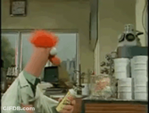 A Man In A Lab Coat Is Holding A Yellow Bottle And A Red Flower . GIF