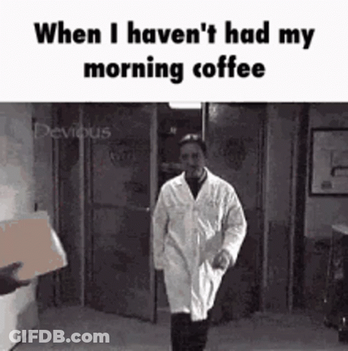 Lab Coat Man Walking Down Hallway With Box GIF
