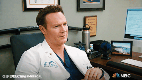 A Man In A Lab Coat That Says St Denis Medical GIF