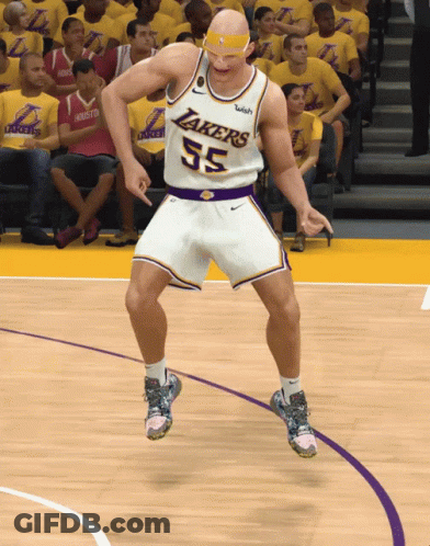 A Man In A Lakers Jersey Is Dancing On A Basketball Court GIF