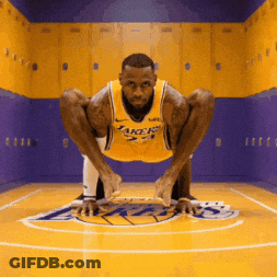 A Man In A Lakers Jersey Squatting On The Court GIF