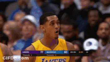 A Man In A Lakers Jersey Stands In Front Of A Crowd During A Basketball Game GIF