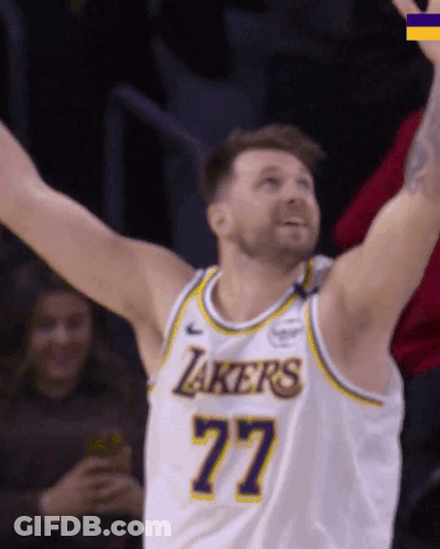 A Man In A Lakers Jersey With The Number 77 GIF