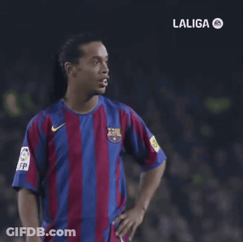 A Man In A Laliga Shirt Is Pointing At Something GIF