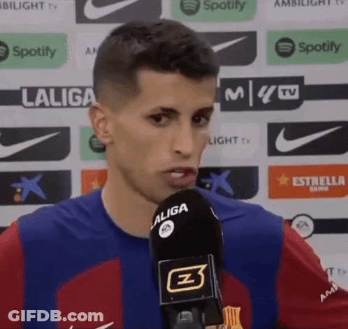 A Man In A Laliga Shirt Is Speaking Into A Microphone GIF