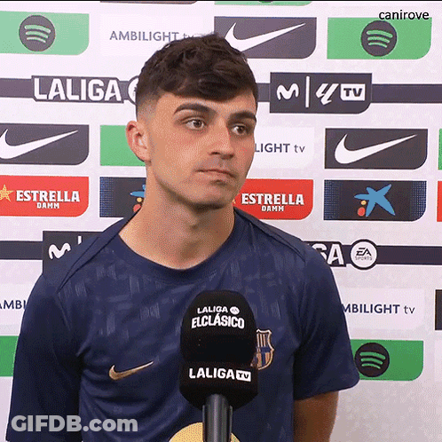 A Man In A Laliga Shirt Stands In Front Of A Backdrop GIF