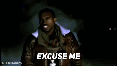 A Man In A Leather Jacket And Scarf Is Standing In Front Of A Blue Background And Says `` Excuse Me '' . GIF