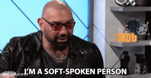 A Man In A Leather Jacket And Sunglasses Says I 'M A Soft-Spoken Person GIF