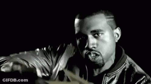 A Man In A Leather Jacket Is Holding A Bunch Of Money In His Hands . GIF