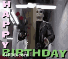 A Man In A Leather Jacket Is Holding A Cardboard Box With The Words Happy Birthday On It GIF