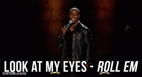 A Man In A Leather Jacket Is Holding A Microphone And Saying `` Look At My Eyes Roll Em '' . GIF
