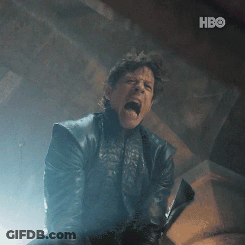A Man In A Leather Jacket Is Screaming And Holding A Sword With The Hbo Logo In The Background GIF