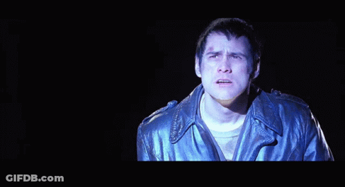 A Man In A Leather Jacket Is Singing The Song Come Again GIF