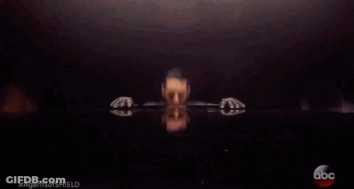 A Man In A Leather Jacket Is Sitting At A Table With The Abc Logo On The Bottom GIF