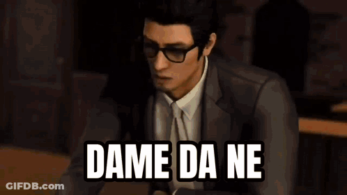 A Man In A Leather Jacket Is Sitting At A Table With The Words `` Dame Da Ne '' Written On The Screen . GIF