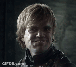 A Man In A Leather Jacket Is Smiling In A Black And White Photo GIF