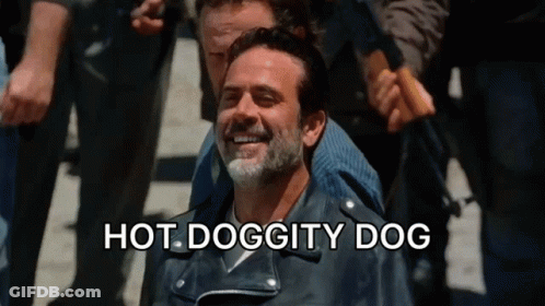 A Man In A Leather Jacket Is Smiling With The Words Hot Doggity Dog Written Below Him GIF