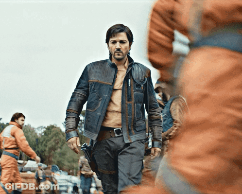 Man In Leather Jacket In Crowd Of People GIF