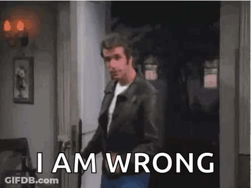 A Man In A Leather Jacket Is Standing In A Doorway With The Words `` I Am Wrong '' . GIF
