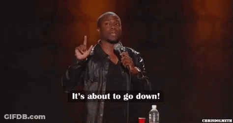 A Man In A Leather Jacket Is Standing In Front Of A Microphone . GIF