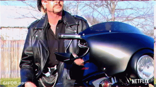 Man In Leather Jacket Next To Netflix Motorcycle GIF