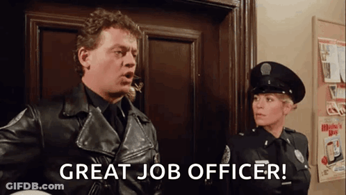 A Man In A Leather Jacket Is Standing Next To A Woman In A Police Uniform And Says `` Great Job Officer '' . GIF