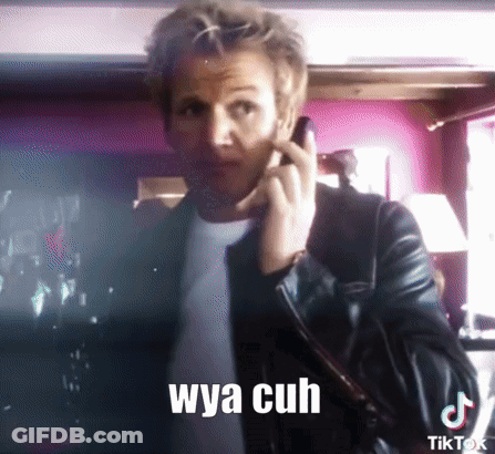 A Man In A Leather Jacket Is Talking On A Cell Phone With A Caption That Says Wya Cuh GIF