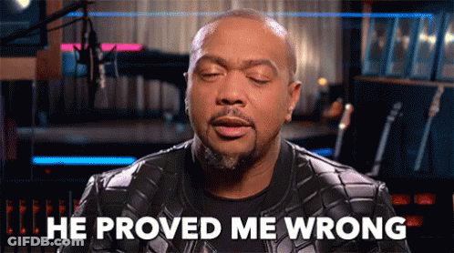A Man In A Leather Jacket Says He Proved Me Wrong In Front Of A Microphone . GIF