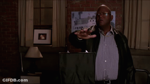 A Man In A Leather Jacket Stands In Front Of A Sign That Says Blessings On It GIF