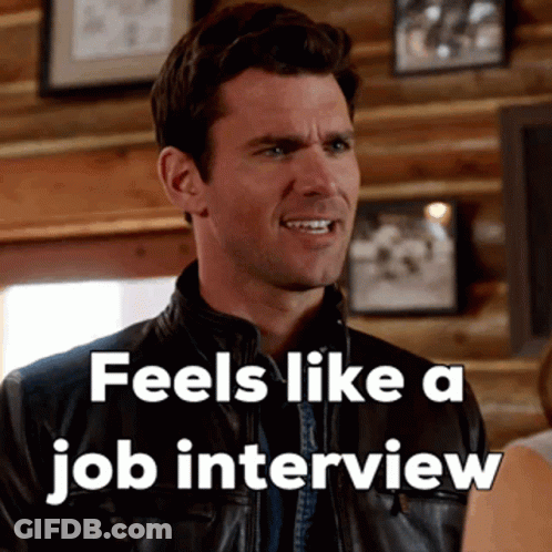 A Man In A Leather Jacket With The Words " Feels Like A Job Interview " Above Him GIF