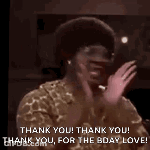 A Man In A Leopard Print Shirt Is Dancing With His Hands In The Air And Saying Thank You ! GIF
