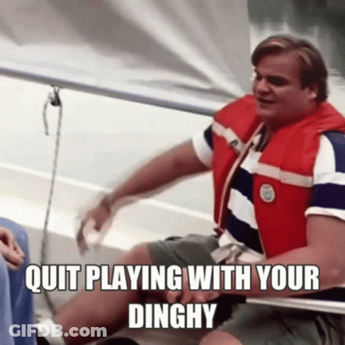 A Man In A Life Jacket Is Sitting On A Boat With The Words `` Quit Playing With Your Dinghy '' . GIF