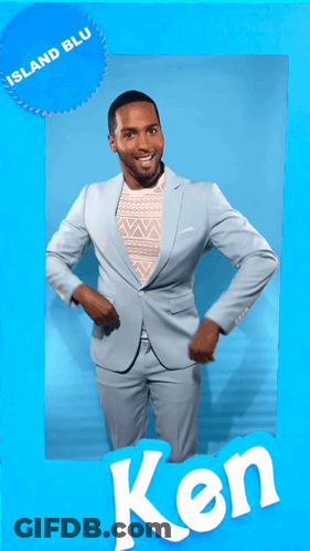 A Man In A Light Blue Suit Is Dancing In Front Of A Blue Background That Says Island Blu GIF