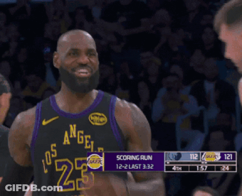 A Man In A Los Angeles Lakers Jersey Smiles GIF