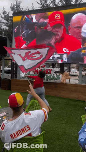 A Man In A Mahomes Jersey Watches A Game GIF