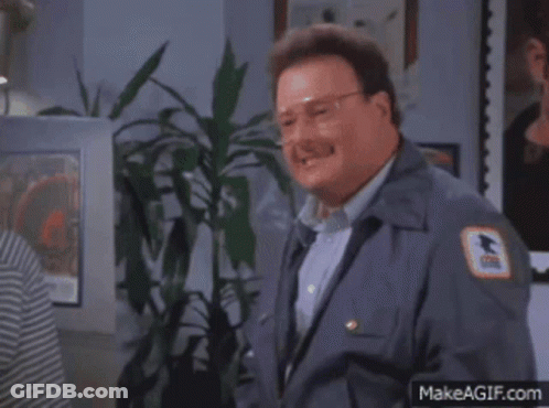 A Man In A Mailman 'S Uniform Has A Us Postal Service Patch On His Chest GIF