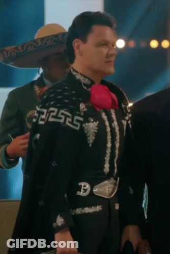 A Man In A Mariachi Outfit Has A Belt With The Letter P On It GIF