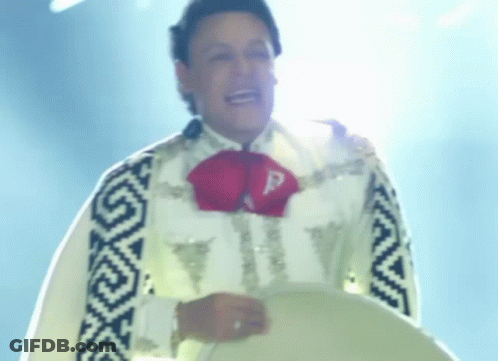 A Man In A Mariachi Outfit Has A Letter P On His Chest GIF
