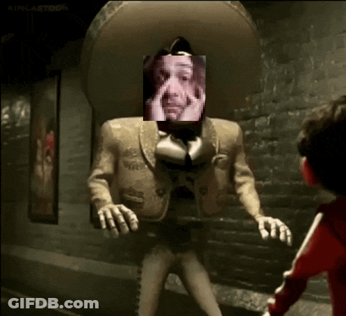 A Man In A Mariachi Outfit Has A Picture Of A Man On His Face GIF
