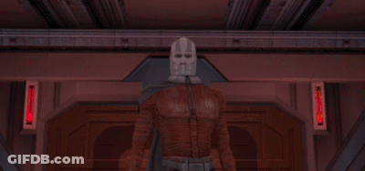 A Man In A Mask Holds A Red Lightsaber GIF