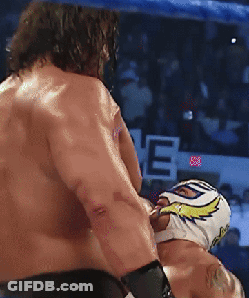 A Man In A Mask Is Being Punched By Another Man GIF