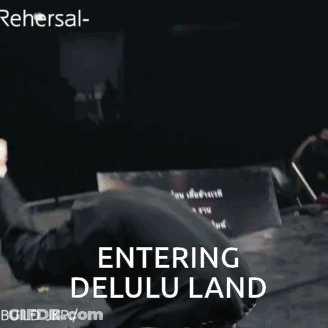 A Man In A Mask Is Doing A Trick With The Words Entering Delulu Land Behind Him GIF