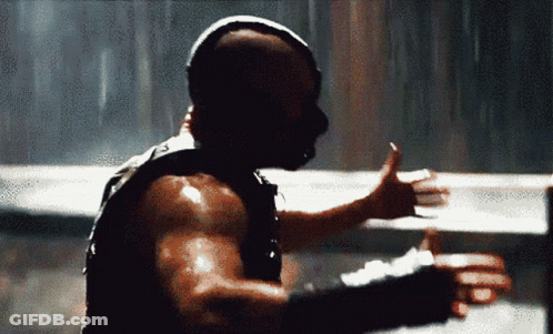 A Man In A Mask Is Giving A Thumbs Up Sign GIF