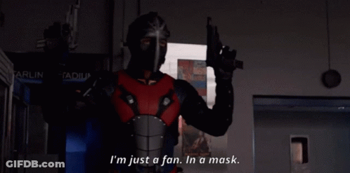 A Man In A Mask Is Holding A Gun And Says " I 'M Just A Fan In A Mask " GIF