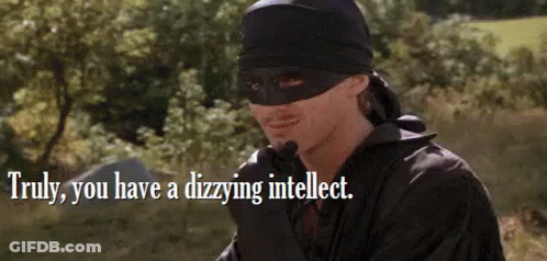A Man In A Mask Is Standing In A Field With A Quote . GIF